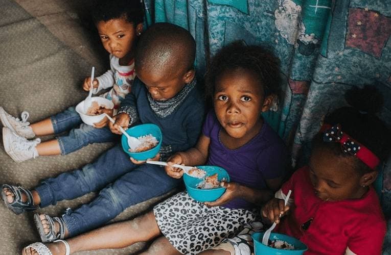 Feeding 2 children in South Africa